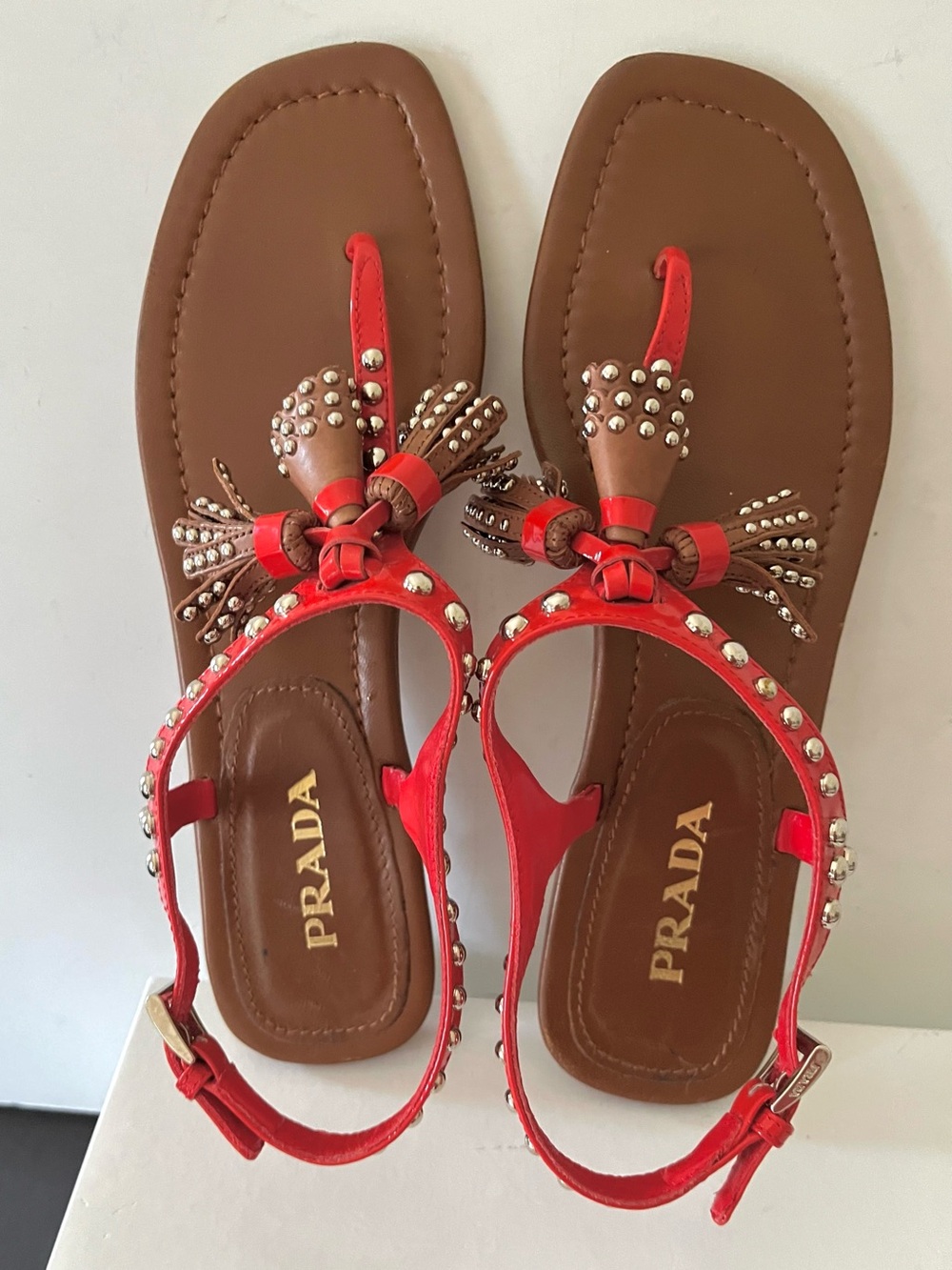 Prada red and brown tassel flat sandals